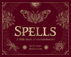 A maroon book cover adorned with gold moths, flowers, insects, and sun motifs houses Spells: A Little Deck of Enchantments by Lorriane Anderson—a flashcard set published by Simon & Schuster, offering 40 pages of enchanting inspiration for anyone interested in spell cards and witchcraft.