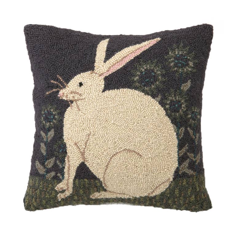 The Hare with Sunflowers Hook Pillow by Peking Handicraft features a cream rabbit on green grass with sunflowers, inspired by Warren Kimble’s folk art style.