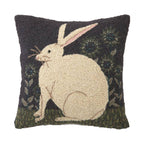 The Hare with Sunflowers Hook Pillow by Peking Handicraft features a cream rabbit on green grass with sunflowers, inspired by Warren Kimble’s folk art style.