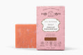 The Organic Vegan Pink Clay + Himalayan Salt Bar Soap by Roots And Leaves is shown beside its pink box, labeled as vegan and cruelty-free, and scented with organic essential oil blends.