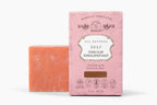 The Organic Vegan Pink Clay + Himalayan Salt Bar Soap by Roots And Leaves is shown beside its pink box, labeled as vegan and cruelty-free, and scented with organic essential oil blends.