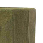 Close-up of the corner of a Foreside Home & Garden Matte Green Ceramic Pot Small, showing its textured surface against a white background.