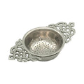 The Madison Bay Co. Nickel Plated Tea Strainer—Antique Vintage Style, 4-1/2”—features ornate handles and a perforated bowl, blending timeless elegance with historical charm for tasteful tea filtering.