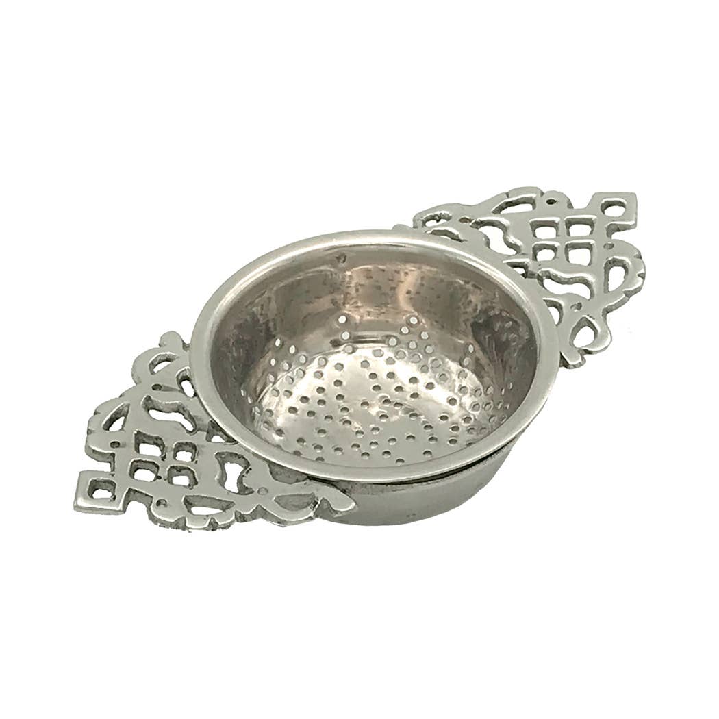 The Madison Bay Co. Nickel Plated Tea Strainer—Antique Vintage Style, 4-1/2”—features ornate handles and a perforated bowl, blending timeless elegance with historical charm for tasteful tea filtering.