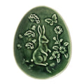 The C&F Home Easter Green Rabbit Toile Shaped Decorative Plate is an oval green ceramic plate with a raised rabbit, spring flowers, and butterfly design.