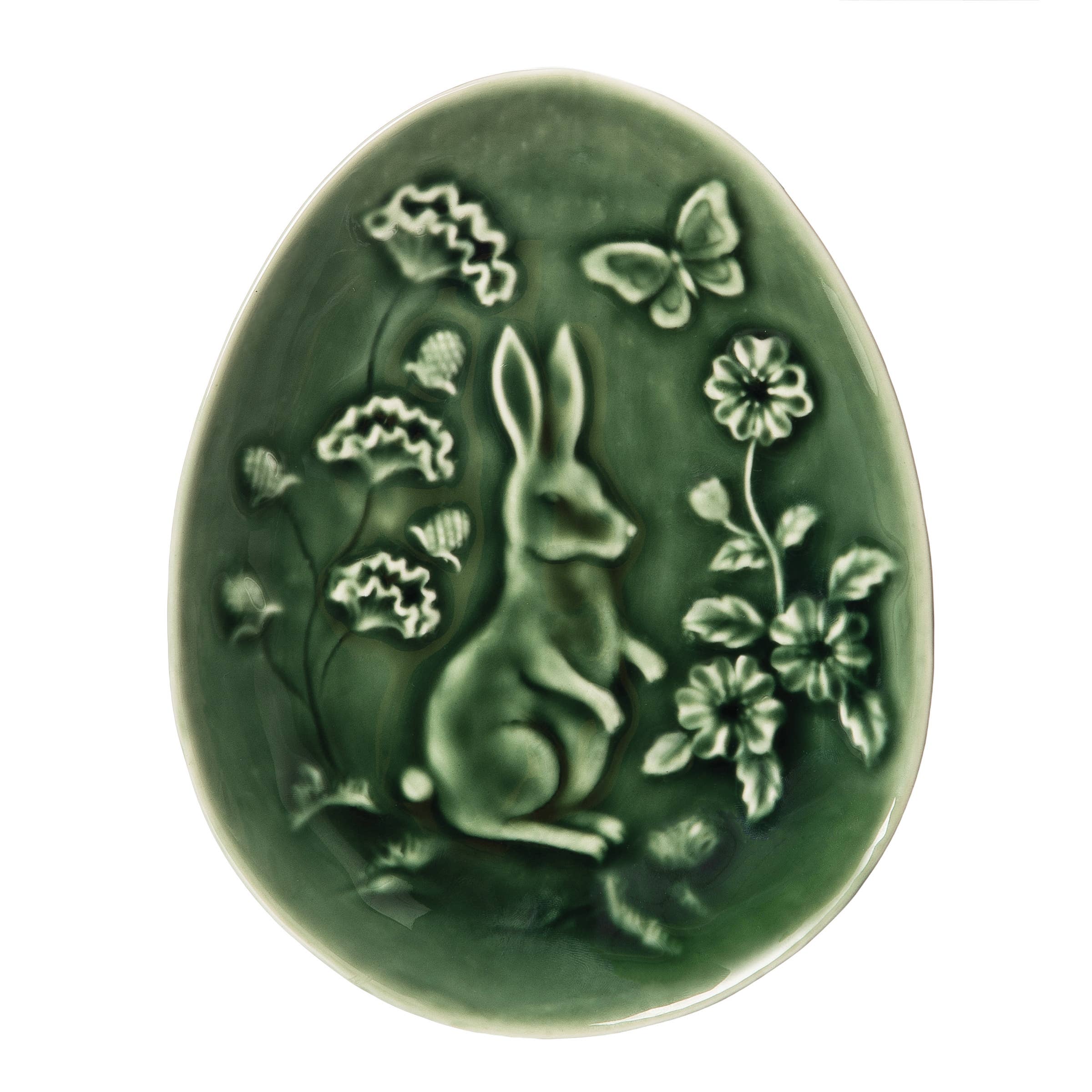 The C&F Home Easter Green Rabbit Toile Shaped Decorative Plate is an oval green ceramic plate with a raised rabbit, spring flowers, and butterfly design.