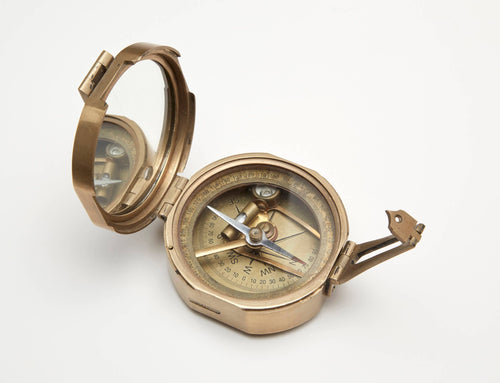 The AA Importing Brass Compass features a glass lid, sighting mechanism, and clear cardinal and degree markings—ideal for precise navigation or as an elegant decorative piece.