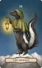 A skunk in a green cloak stands atop a snowy mountain, holding a lantern and staff as The Hermit card from the Tarot of the Woodland Wardens by Jessica Roux. The scene—under a starry sky with mountains in the distance—reflects the enchanting nature-inspired artwork of this 224-page mixed media tarot deck (Simon & Schuster), evoking themes of solitude and wisdom amid the wilderness.