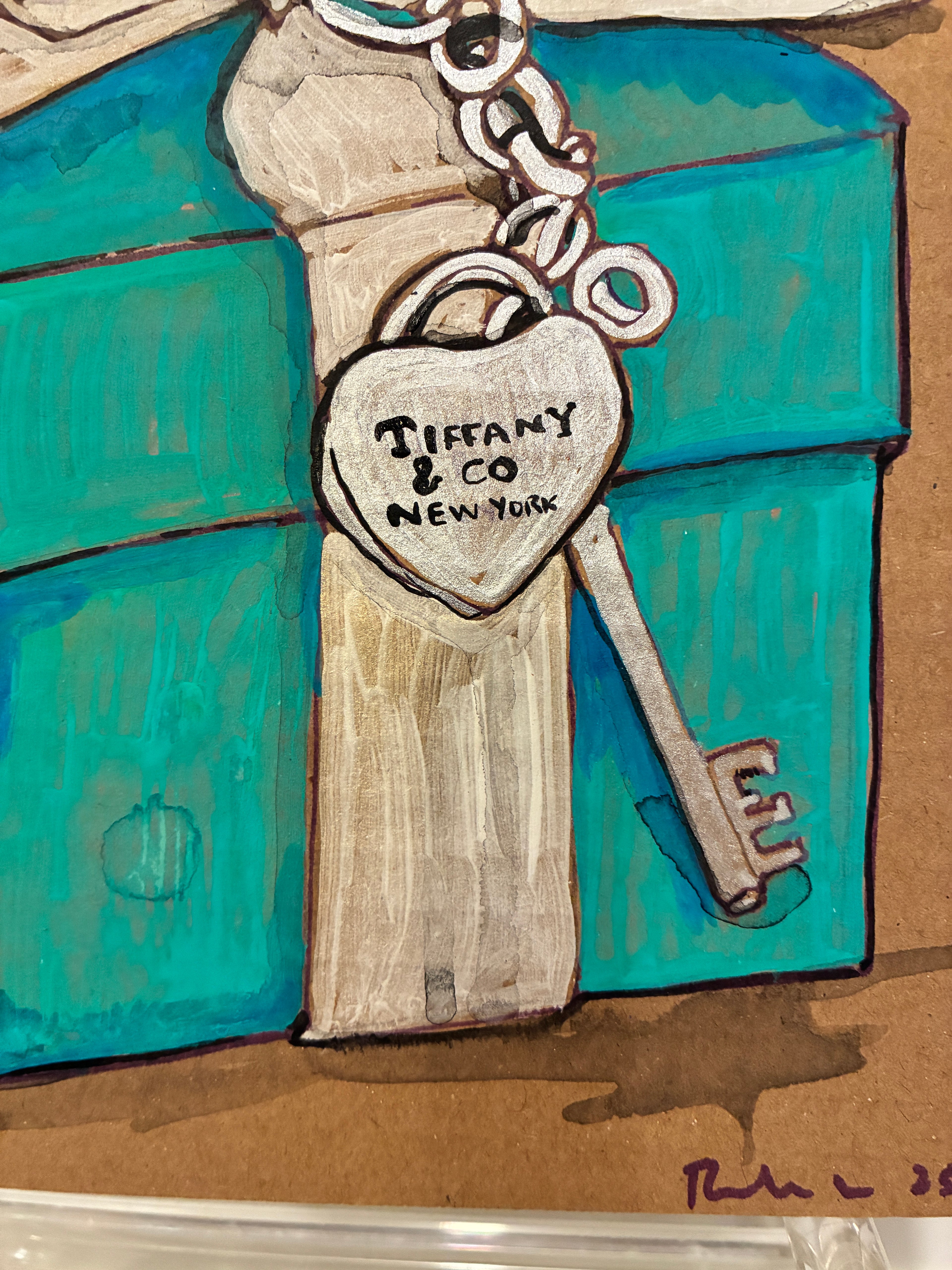 A drawing of a silver heart-shaped Tiffany tag and key charm rests on a teal box with white ribbon, reflecting the elegance of Rachel Nelson • Tiffany by Thyne Goods. The heart tag is engraved with "TIFFANY & CO. NEW YORK.