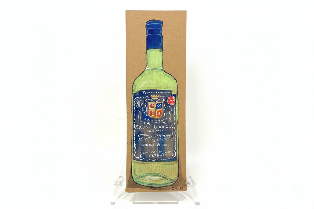 A hand-drawn green wine bottle with a blue label is shown upright on brown cardboard. "Rachel Nelson • Young + Refreshing" by Thyne Goods stands on a clear easel against a plain white background.
