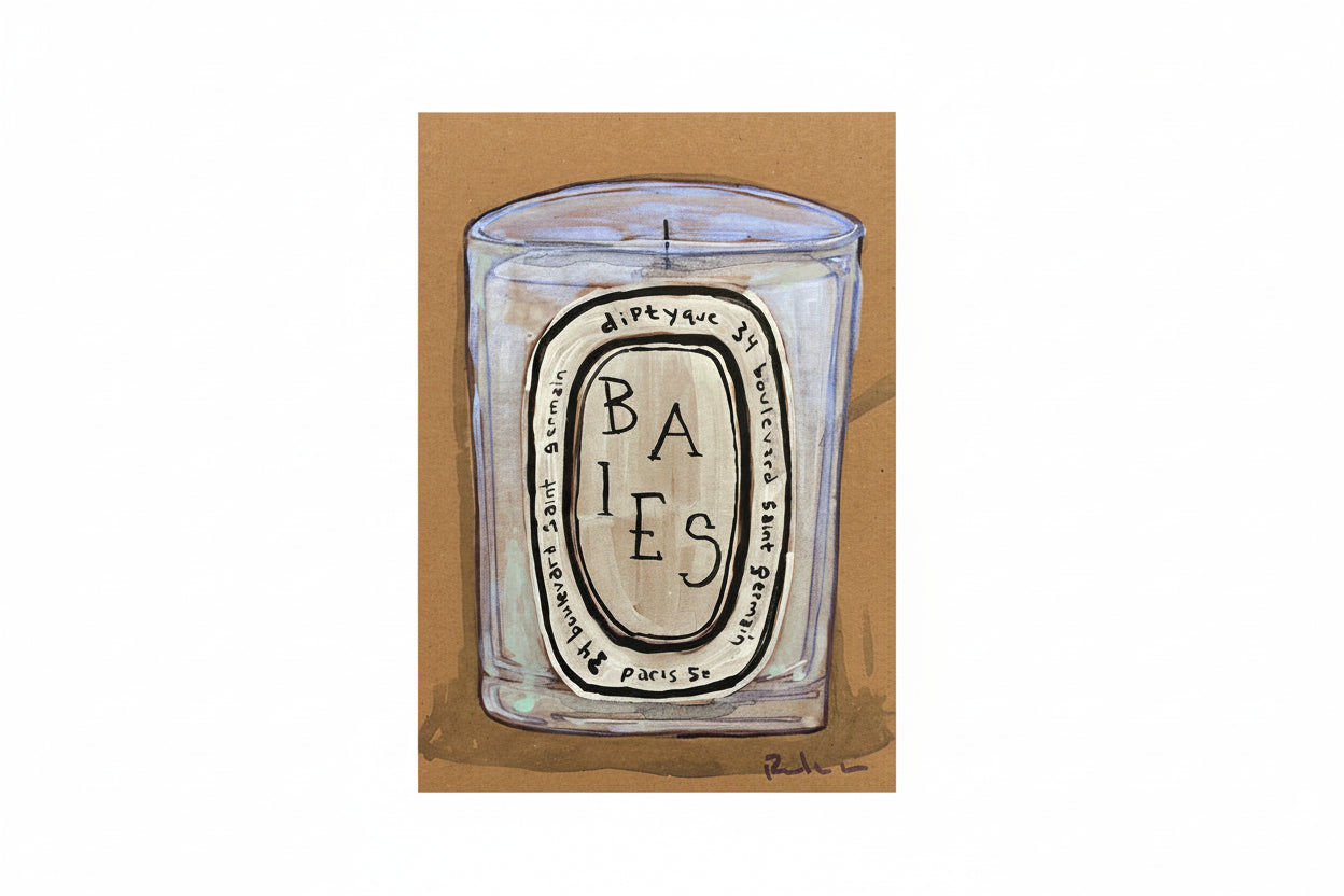 A clear glass candle labeled "Rachel Nelson • Baies Paris" by Thyne Goods, featuring black text on a white label with French details, is set against a brown background—capturing an elegant Rachel Nelson-inspired aesthetic.