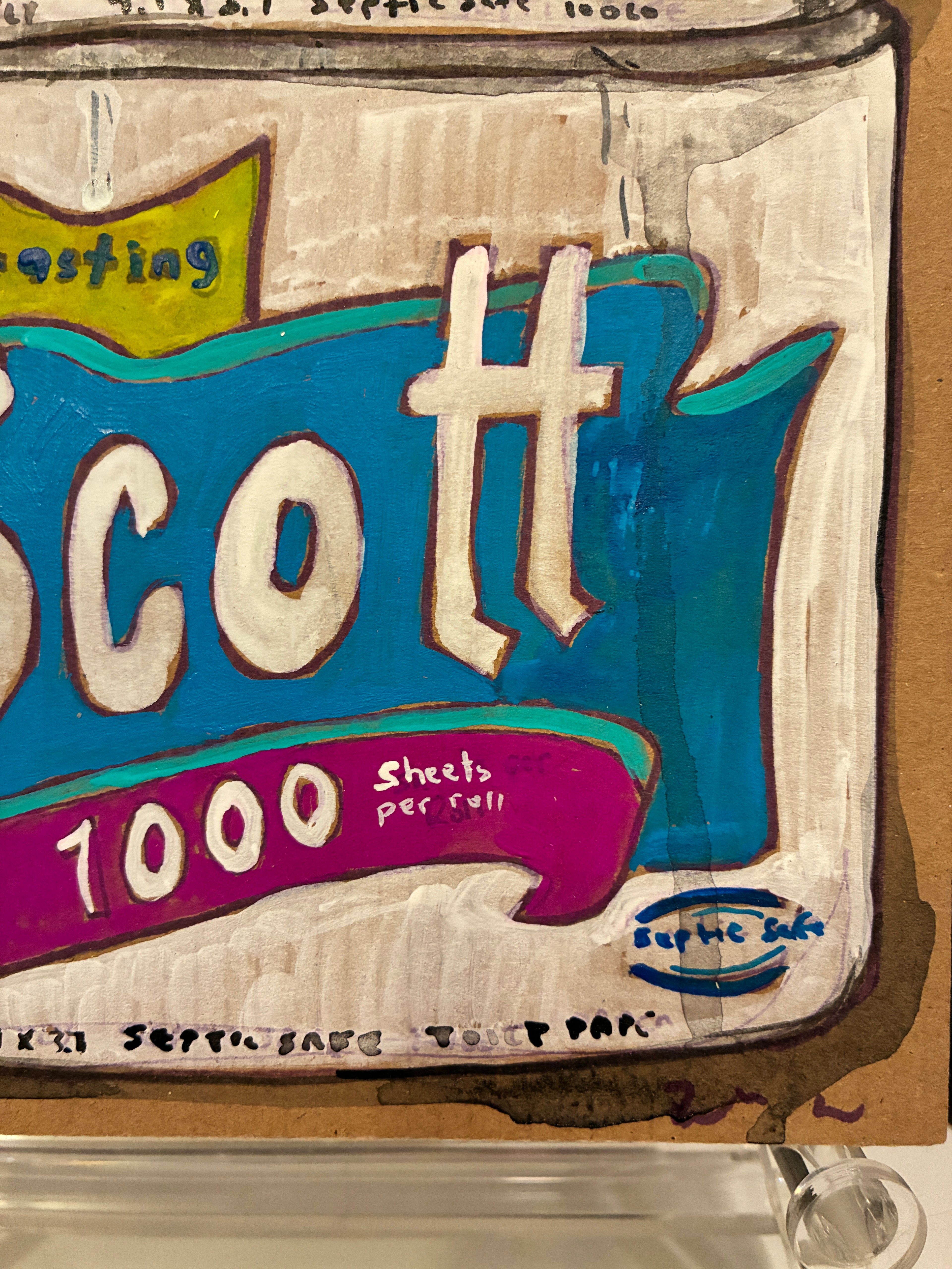 A close-up of a sign for "Rachel Nelson • Two Scotts" by Thyne Goods, set against giant neon flower paintings, adds vibrant energy to the scene.