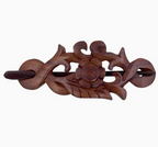 The Benjamin International Wooden Hair Pin features a handcrafted floral and leaf design with a central flower motif and decorative carved details.