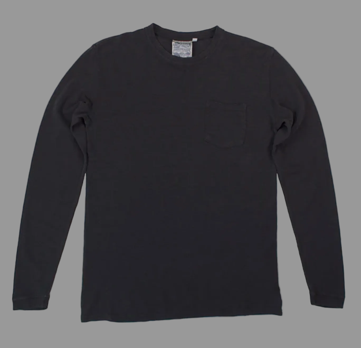 The Baja Long Sleeve Tee by Thyne Goods is a plain black top made from soft hemp cotton, featuring a small left chest pocket and displayed flat on a white background.
