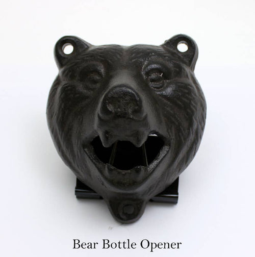 The Bear Style Bottle Opener by Koppers Home features a metal bear head with an open mouth, displayed on a white background. Ideal for any barware collection, “Bear Style Bottle Opener” is printed below.