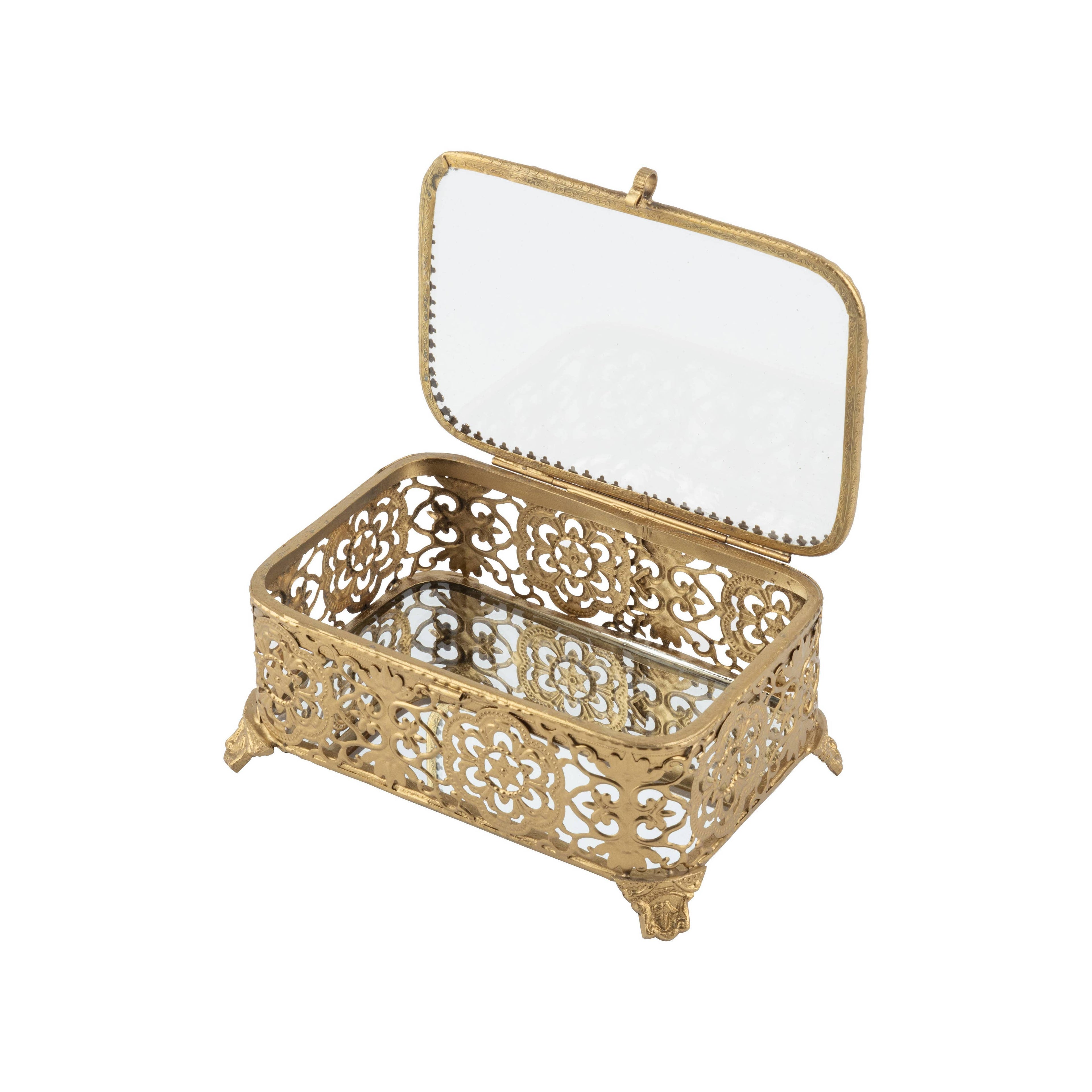 The Filigree Box by Silver Tree Home & Holiday features ornate gold filigree, decorative feet, a hinged lid with inner mirror, floral side patterns, and a mirrored base—shown against a white background.