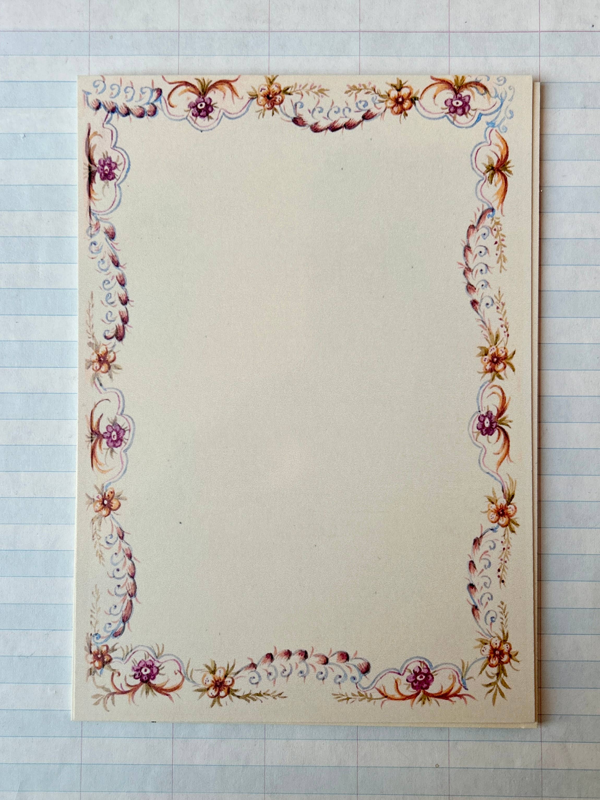 The Parcel French Menu Stationery Set II: 2 features creamy white cardstock cards with ornate red, purple, and gold floral borders—ideal for special occasions as single printed cards or in a set of 8.