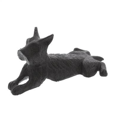 The HomArt Terrier Door Wedge is an antique brown cast iron sculpture, shaped like a dog lying down with front legs extended and head slightly raised.