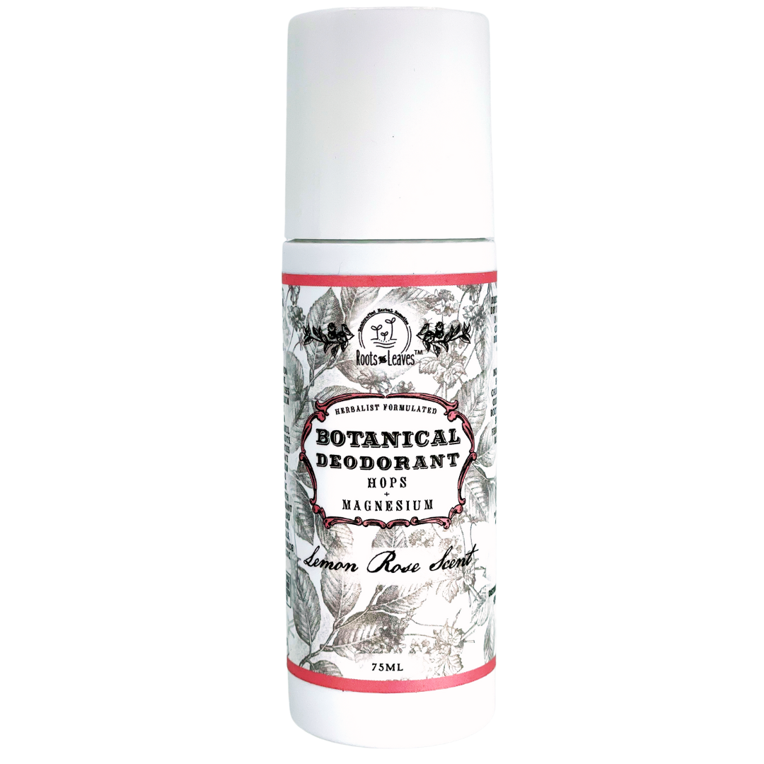 A 75ml white cylindrical bottle of Roots And Leaves Botanical Magnesium Deodorant features a black-and-white floral label with pink accents; it’s baking soda free and scented with lemon rose, highlighting hops and magnesium.