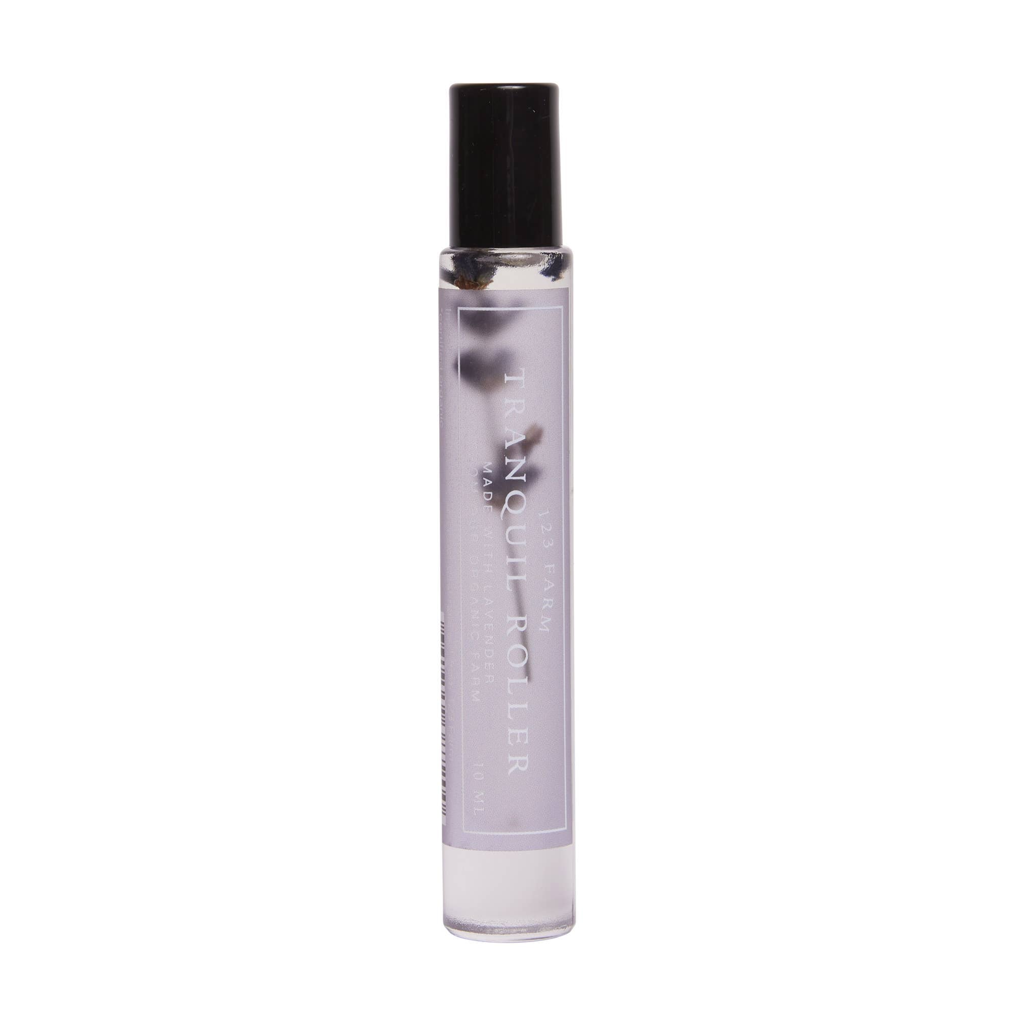 The 123 Farm Lavender Tranquil Roller – Organic Blend for Relaxation 10ml is a clear, portable bottle with light purple liquid and dark stones, perfect for on-the-go aromatherapy and organic relaxation.