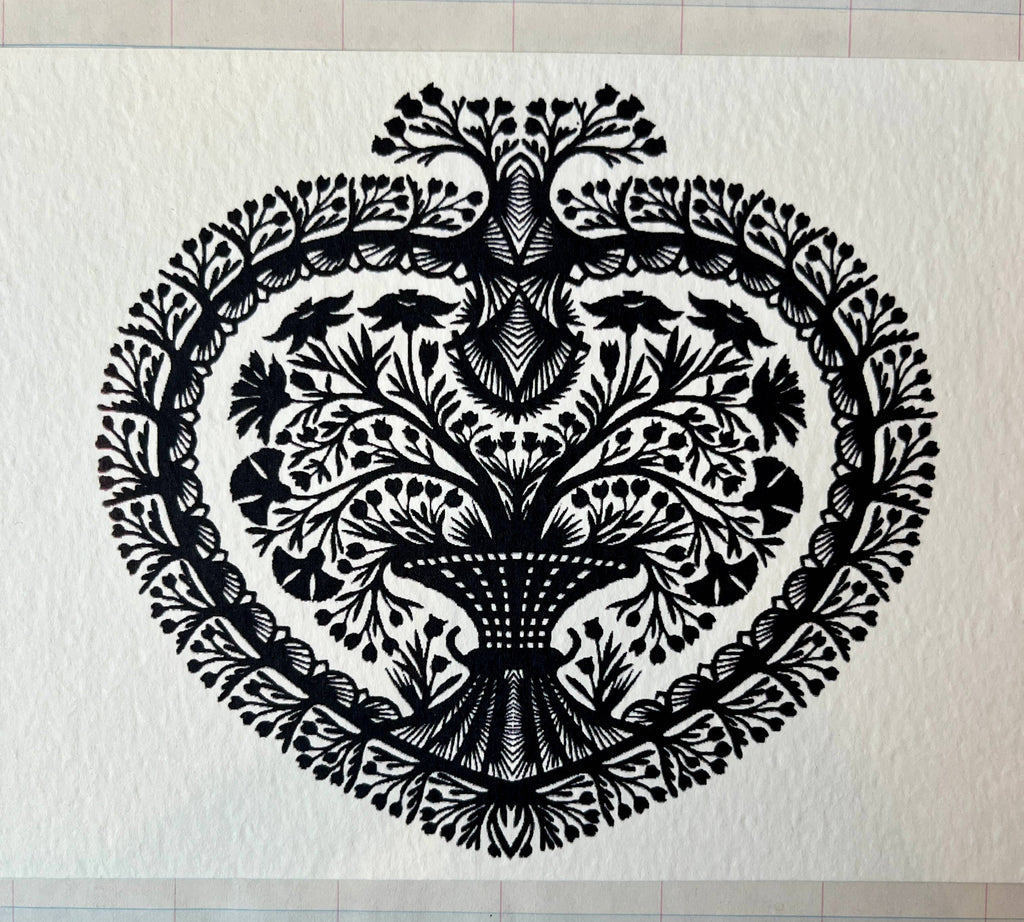 Papercut Heart Art Cards by Parcel feature an intricate black symmetrical tree with detailed leaves and branches inside a heart-shaped border on textured white. Comes as a 5x7 card with a creamy white envelope.