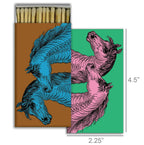 The HomArt Match - Wild Horses box, measuring 4.5" x 2.25", features a colorful cover with two illustrated horse heads and comes filled with safety matches—a striking piece of graphic decor.