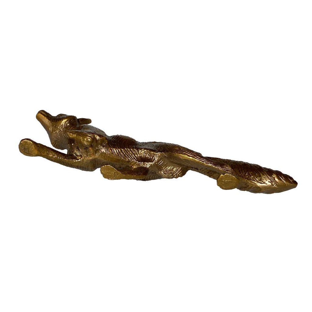 The Solid Antiqued Brass Running Fox Tabletop Desk Decor by Madison Bay Co. - Historical Home Decor Reproductions features a stretched fox, ideal as unique tabletop decor or a charming paperweight.