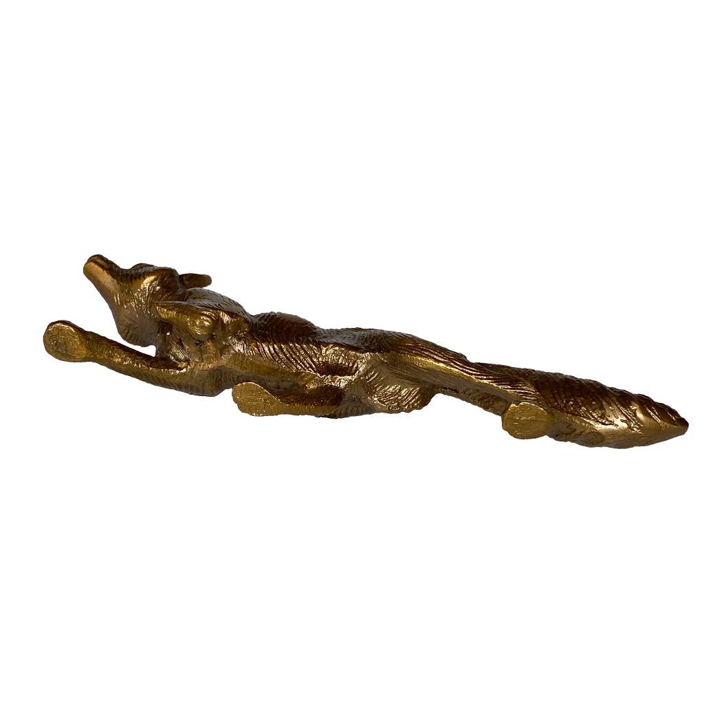 The Solid Antiqued Brass Running Fox Tabletop Desk Decor by Madison Bay Co. - Historical Home Decor Reproductions features a stretched fox, ideal as unique tabletop decor or a charming paperweight.