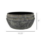 The Yara Low Planter by HomArt is a large, round, dark gray cement bowl with a ribbed top. At 5" tall and 10.25" wide, this rustic planter adds stylish garden decor to any space. Measurement lines show its exact dimensions.