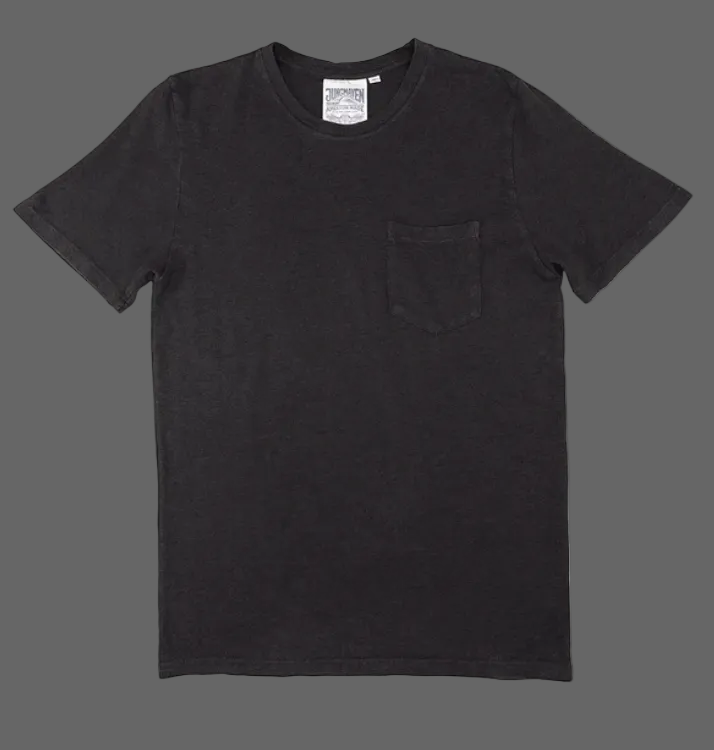 Black t-shirt with a pocket on a grey background