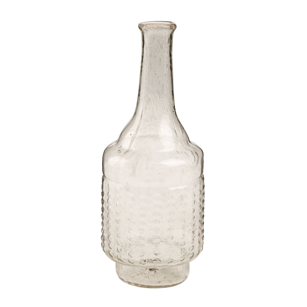 The Indaba Trading Recycled Glass Bottle Vase, Clear, features a long narrow neck, rounded body with a textured dimpled pattern, and flat base. This vintage-inspired vase is empty and displayed against a plain white background.