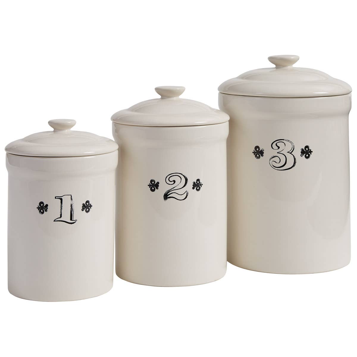 The Park Designs Ironstone Set of 3 Canisters features cream-colored ceramic canisters with lids, labeled 1, 2, and 3 in black decorative font, arranged from shortest to tallest—ideal for storing tea or coffee.