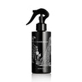 O TANNENBAUM ROOM SPRAY: 200ML by Heretic Parfum, in a black trigger bottle with a Gorey-style child and Christmas tree illustration, adds festive fir needles fragrance to your space.