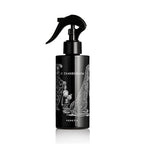 O TANNENBAUM ROOM SPRAY: 200ML by Heretic Parfum, in a black trigger bottle with a Gorey-style child and Christmas tree illustration, adds festive fir needles fragrance to your space.