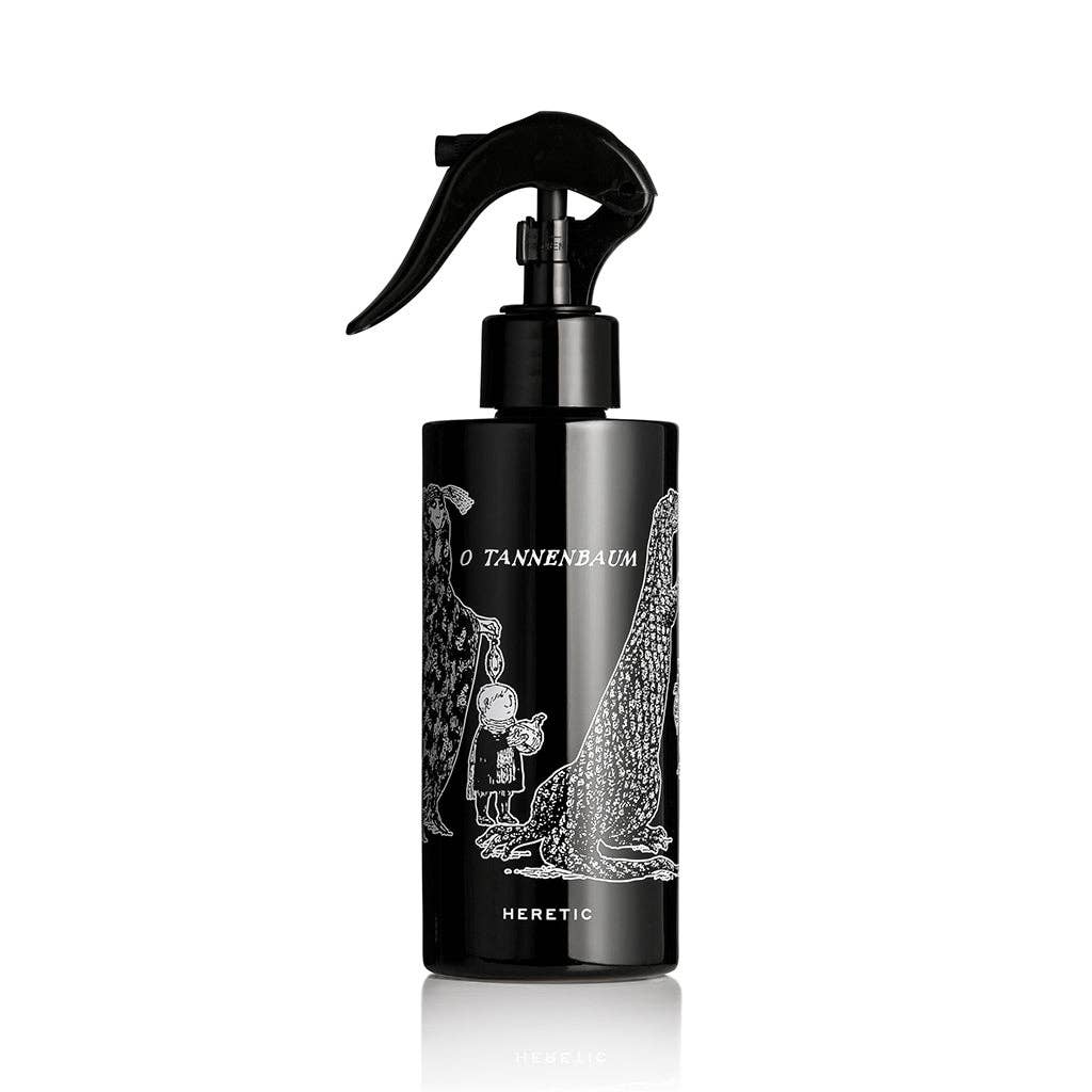 O TANNENBAUM ROOM SPRAY: 200ML by Heretic Parfum, in a black trigger bottle with a Gorey-style child and Christmas tree illustration, adds festive fir needles fragrance to your space.