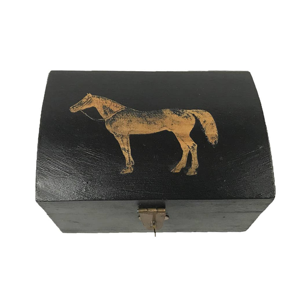 The Madison Bay Co. Standing Horse Antiqued Wood Box, 4-3/4”, is a black, rectangular mango wood jewelry box with a curved lid, engraved horse design on top, and a small metal latch at the front.