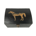 The Madison Bay Co. Standing Horse Antiqued Wood Box, 4-3/4”, is a black, rectangular mango wood jewelry box with a curved lid, engraved horse design on top, and a small metal latch at the front.