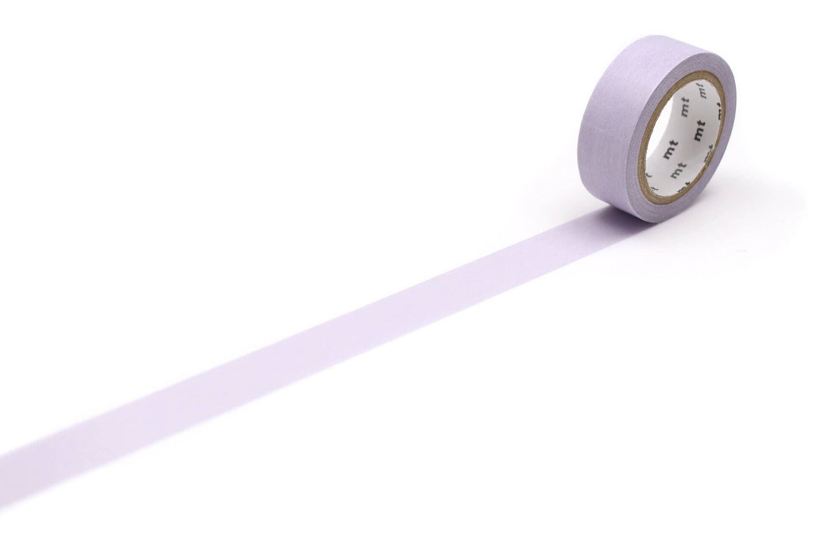 A roll of Washi Tape: Pastel Lavender with a length of the light purple tape pulled out across the surface.