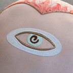 The Skippy Cotton Sacred Heart Pillow is a handmade, cotton-filled cushion that makes a whimsical addition to any space.