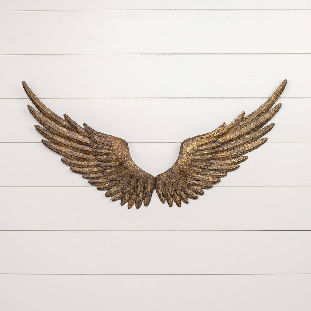 The ANTIQUE REPRODUCTION GOLD WALL WINGS by Ragon House feature a rustic golden-bronze finish and hang symmetrically on a white shiplap wall with sturdy keyhole hangers, creating striking decorative wall art.