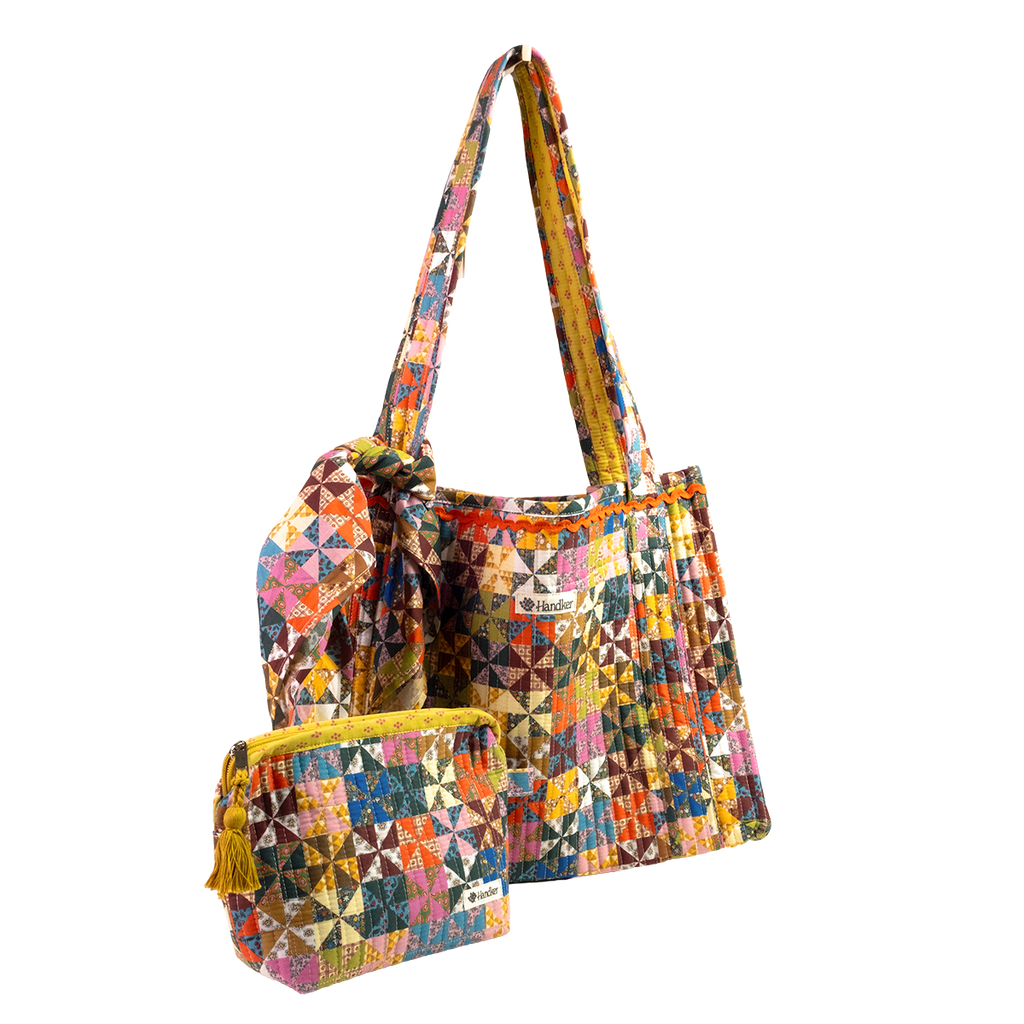 The Calico Quilted Tote set by Handker Bandanas features a quilted tote, drawstring bag, and zippered pouch in colorful bandana cotton patchwork, all displayed on a white background.
