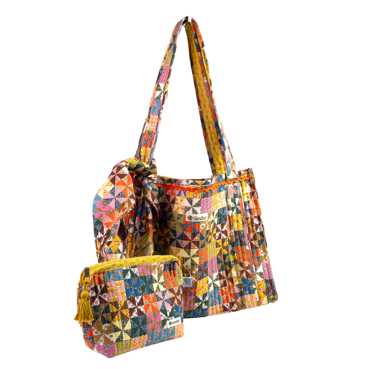 The Calico Quilted Tote set by Handker Bandanas features a quilted tote, drawstring bag, and zippered pouch in colorful bandana cotton patchwork, all displayed on a white background.