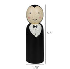 The HomArt Wood Vampire is a hand-painted, carved wood peg doll with fangs, rosy cheeks, and a black tuxedo. At 5.5" tall and 1.75" wide, it’s a charming Halloween decor piece for your seasonal display.