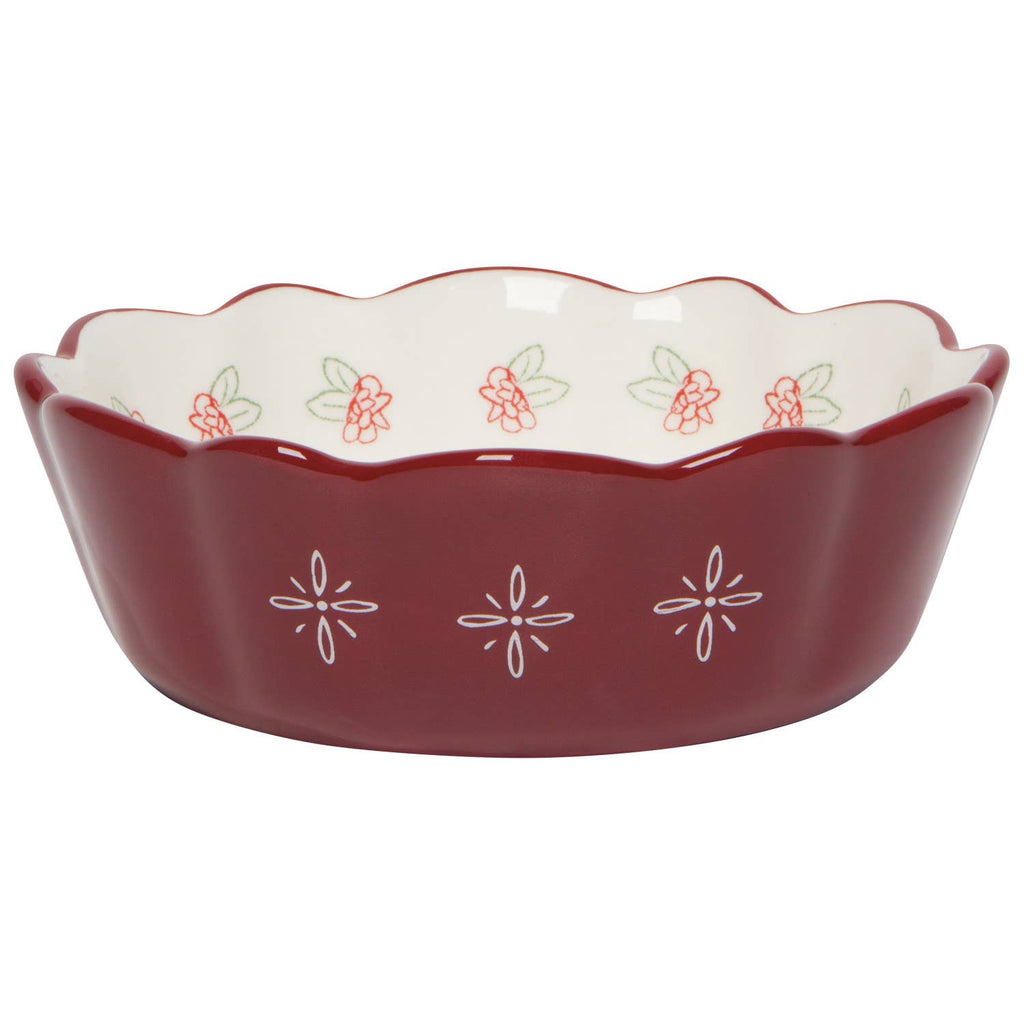 The Danica Heirloom Camellia Bowl Medium 5.75 inch features a red scalloped edge, white floral exterior, and red-green flower designs inside—perfect for adding rustic farmhouse charm.
