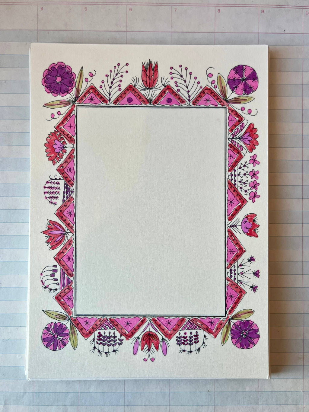 The Parcel Colorful Folk Frame features a blank white cardstock card with a hand-drawn floral border in pink, red, and purple shades framing an empty center. Set of 8.
