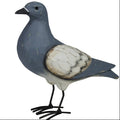 The HomArt "Pigeon, Wood" is a nature-inspired hand-painted wooden bird figurine with a blue-gray body, white wings with dark accents, and black metal legs—an upright, charming home decor piece.