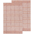 Rectangular rug with pink and white grid lines, inspired by Danica Heirloom’s Bisque Finley Check Dishtowels Set of 2. Features an L-shaped cut-out in one corner that disrupts the classic checked pattern.