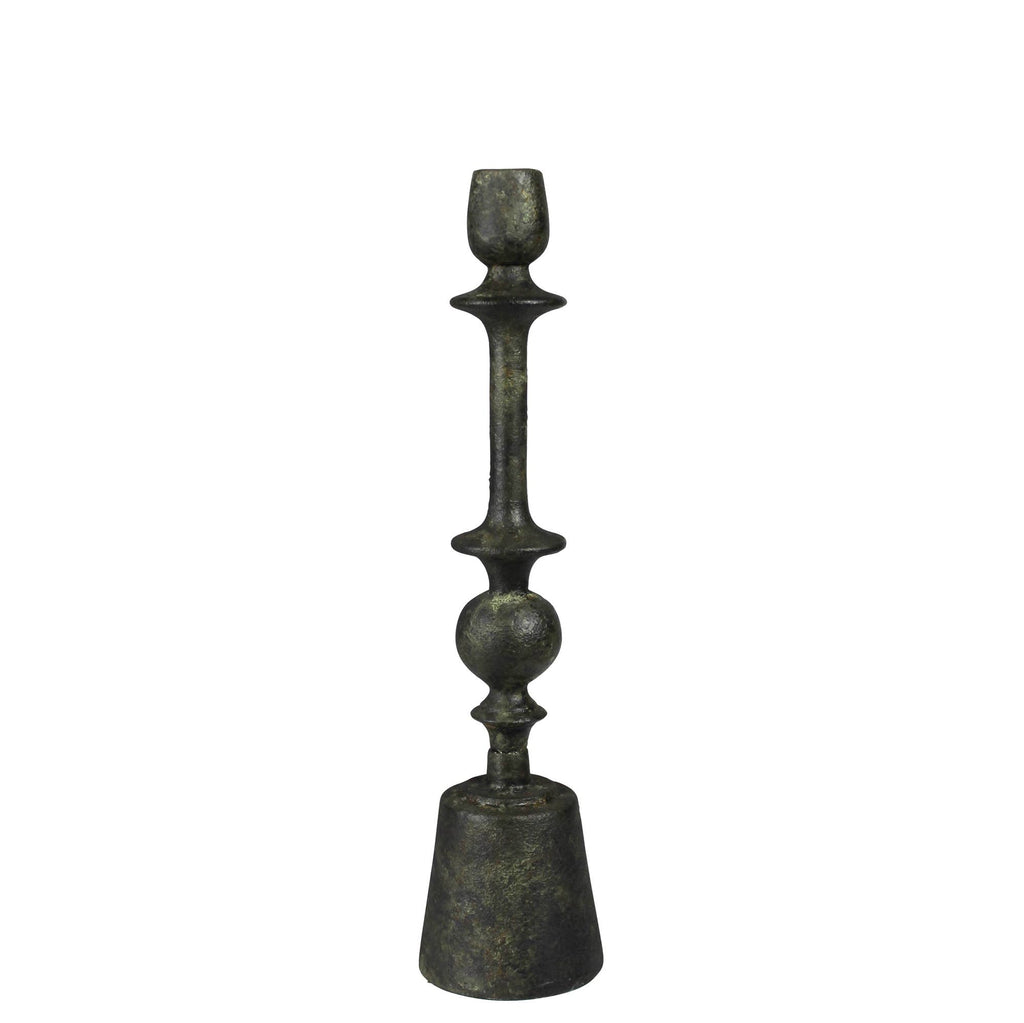 The HomArt Bastia Taper Holder, Green Patina - Med features a tall, dark, antique-style design with geometric accents and a textured finish—ideal for bringing vintage charm to your decor.
