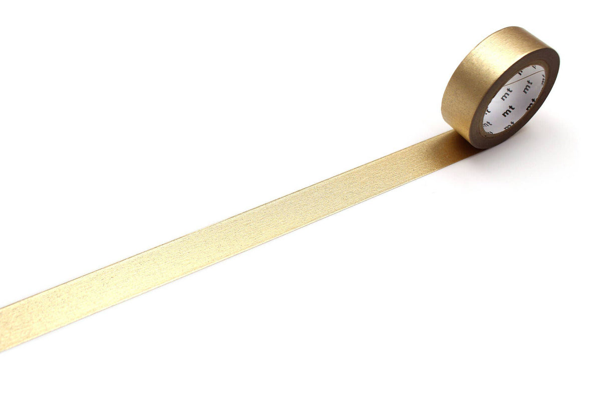 A roll of mt masking tape (Sweet Bella) High Brightness Champagne Gold washi tape with a strip unrolled against a white background.
