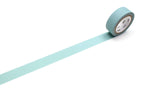 A roll of mt masking tape (Sweet Bella) in Matte Smoky Mint with a length of the tape pulled out across a white surface.